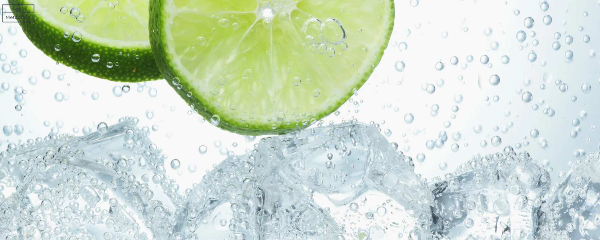 Sliced lime in water with ice cubes