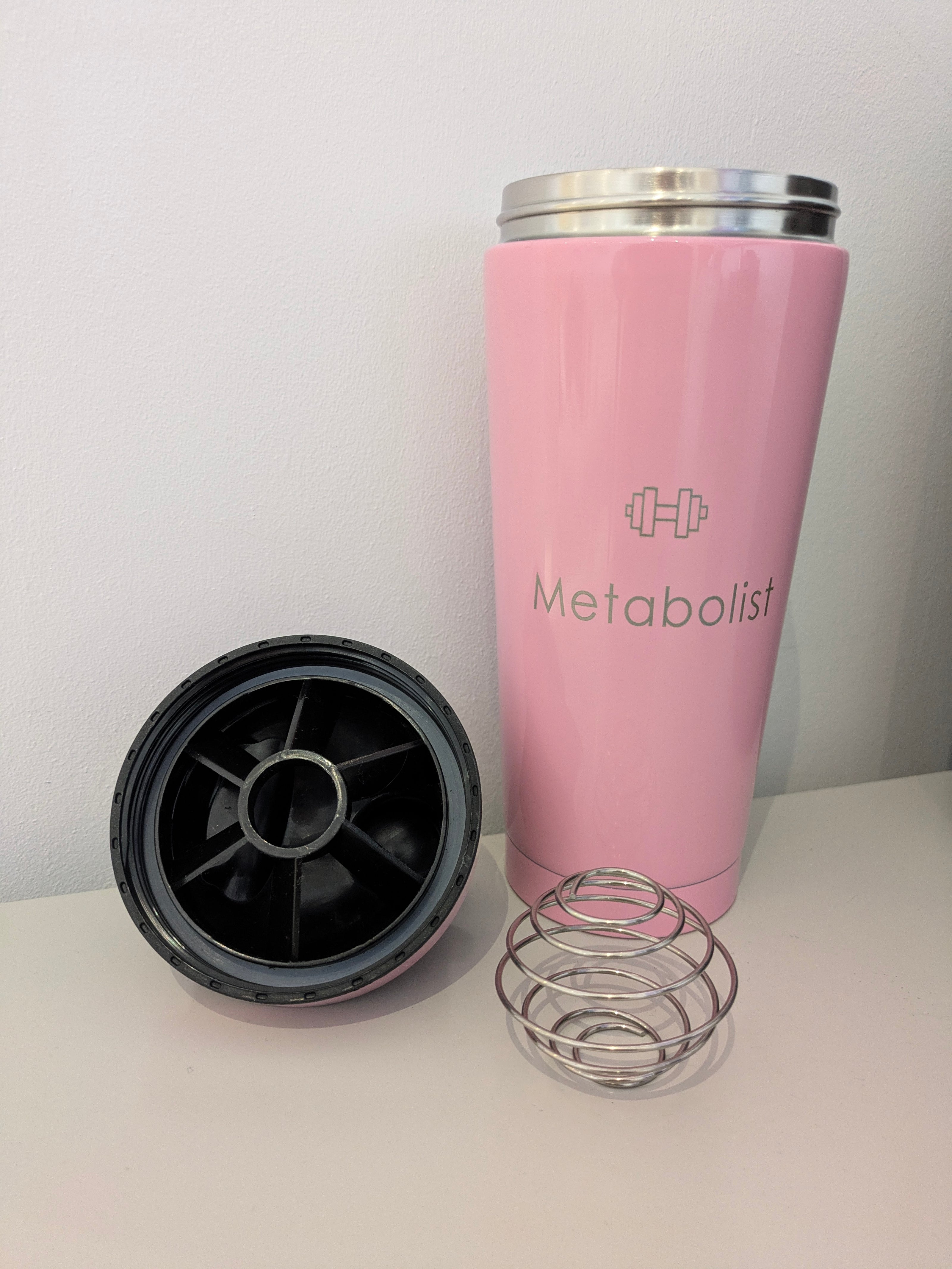 Pink tumbler with 'Metabolist' branding on a white surface. Metabolist Premium Stainless Steel Precision Shaker Bottle.