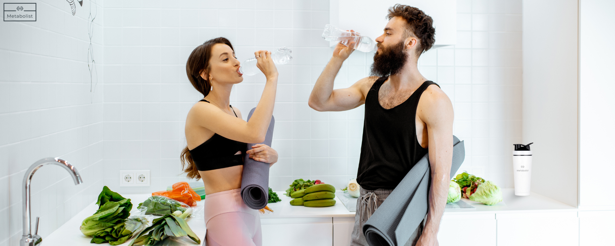 Two people with yoga mats in a kitchen setting, with Metabolist White Bottle 